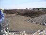 Designer for double lined landfill with steep sideslopes and benches 